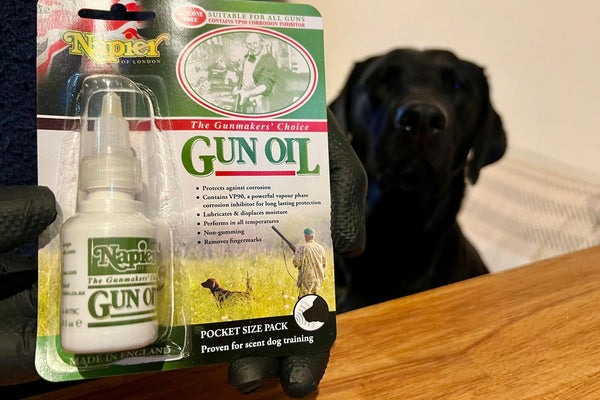 Gun oil and a black labrador