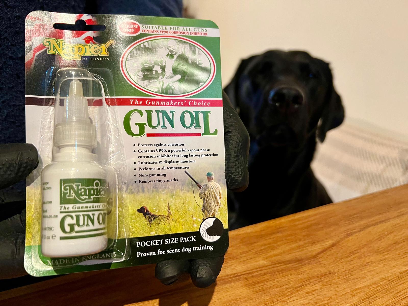 Gun oil and a black labrador