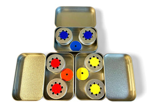 three tins in blue, red and yellow